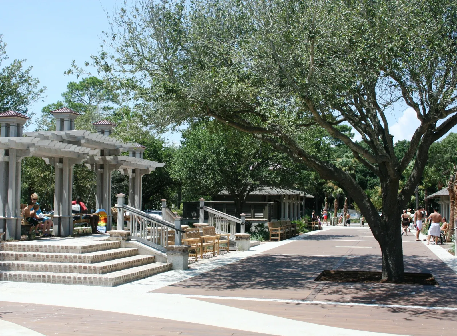 Walkway, shade trees and seating at Coligny Beach Park